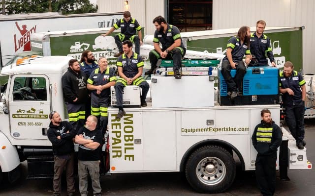 Auto repair shop exterior or service bay with vehicles being serviced